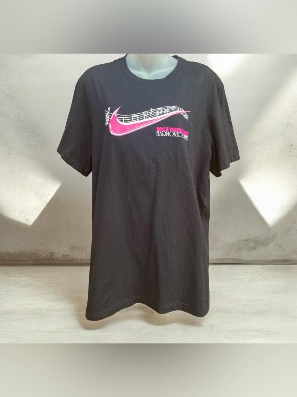 Black Short-Sleeve Graphic Tee with Pink Swoosh Accent